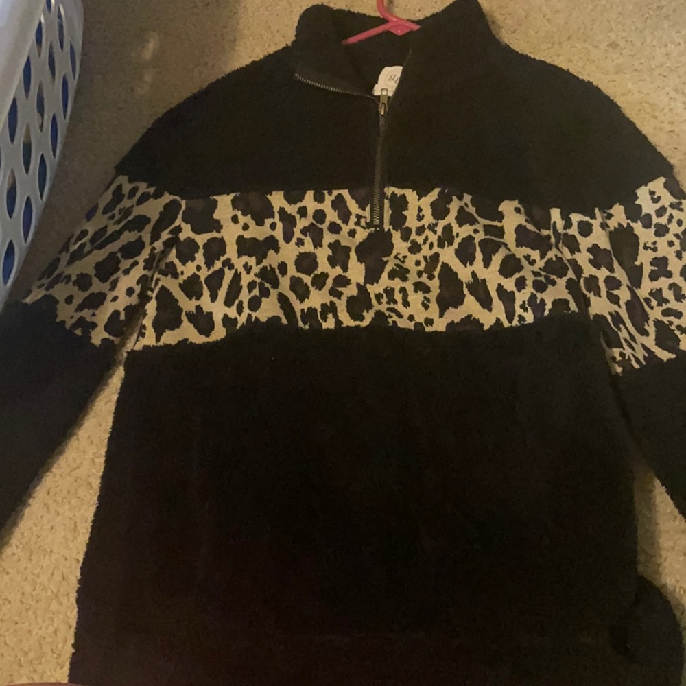 Fuzzy, half zip, keeps you super warm. Worn twice